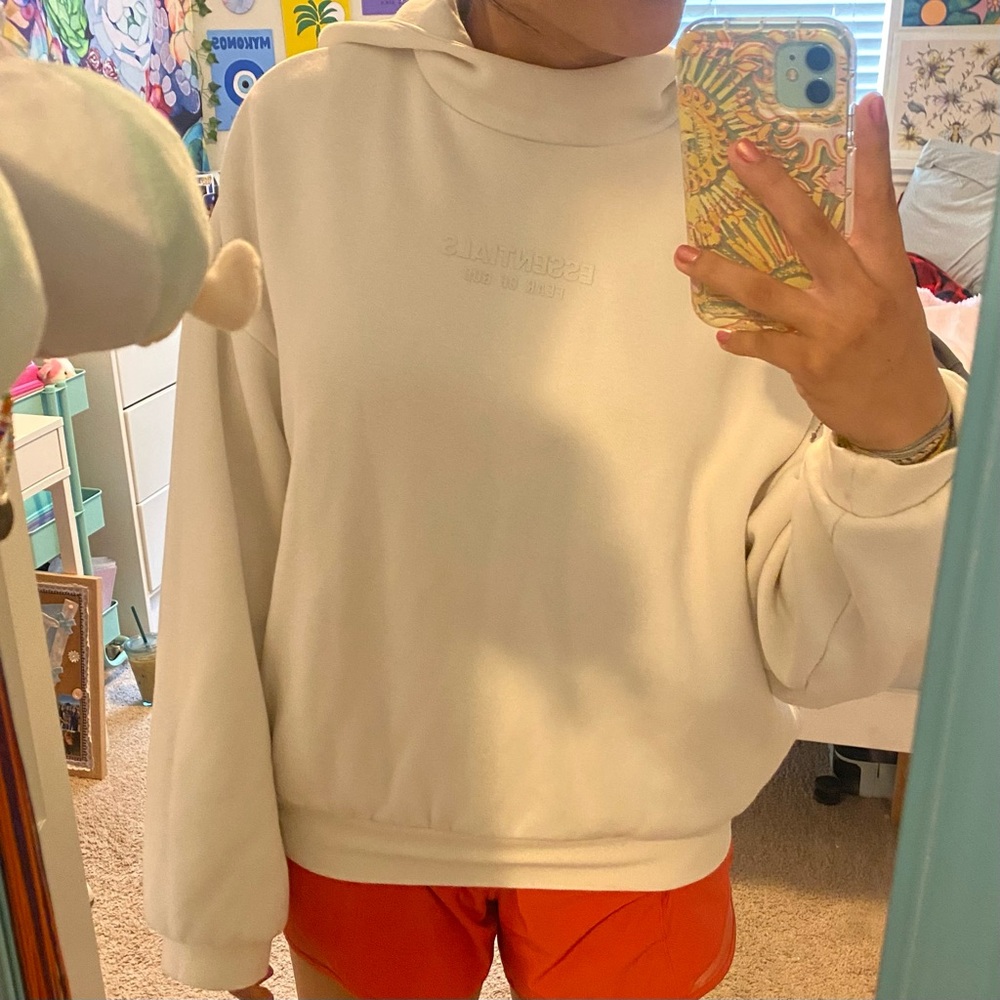 White cream Fear of God Essentials white hoodie